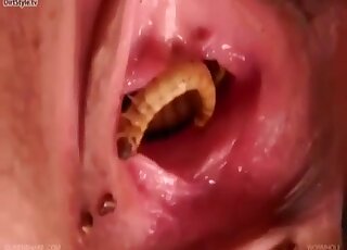 Masked blonde can't hide moans of pleasure from sex with worms