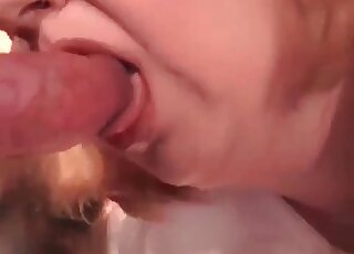 Insatiable mature slut stuffs mouth with a pink dick of a canine